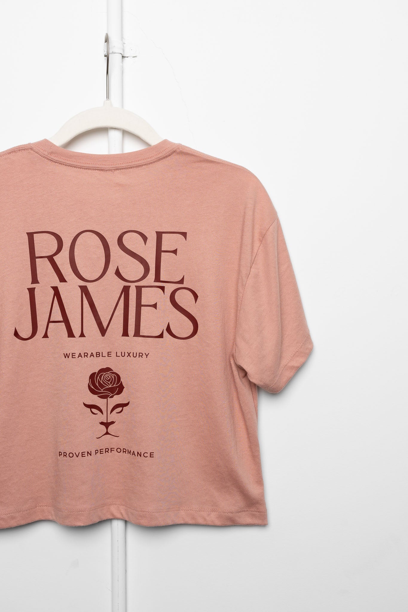 Pink t-shirt with 'Rose James' branding on a white background
