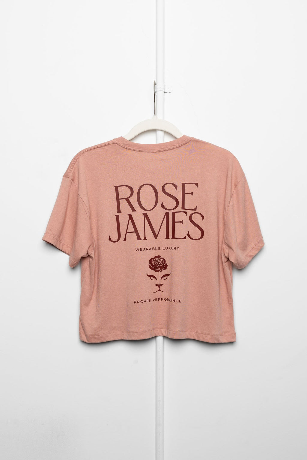 Pink t-shirt with 'Rose James' text on a white background